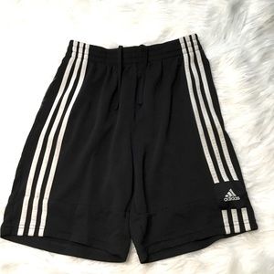 Boys black Adidas shorts with drawstring waist.
